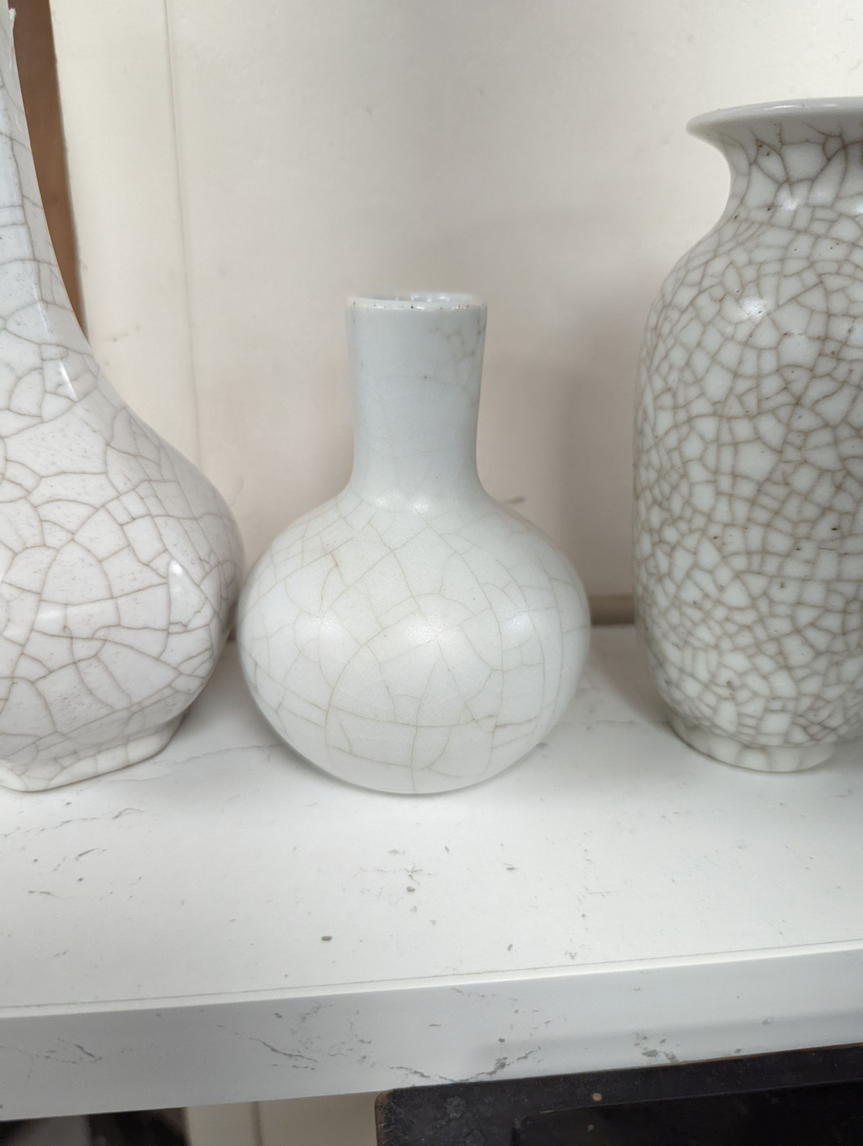 Four Chinese crackle glaze vases, tallest 16 cms high.